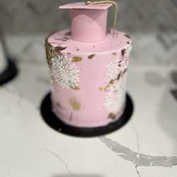Sunshine's Cakes - Buttercream cake with fondant cake topper. And gold leaf.