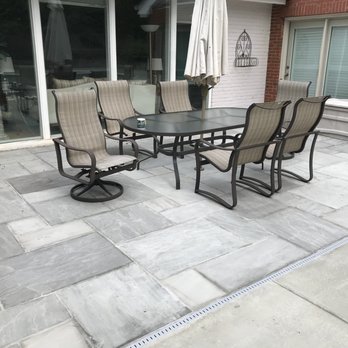 Millennium Pools & Spas - New flagstone patio with new underground drainage - Pool Cleaners Near Me - Springfield, Virginia Millennium Pools & Spas - New flagstone patio with new underground drainage - Pool Cleaners Near Me - Springfield, Virginia