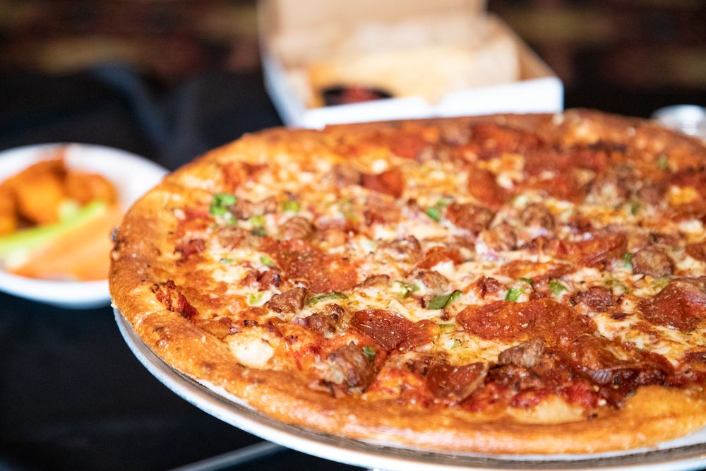 Champions Pizza Logo