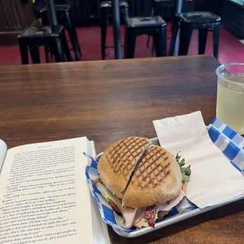 Old Moon Deli - Turkey sandwich ( added tomato, Avacado , and pickles) with a mango kombucha - Delis Near Me - Galveston, Texas Old Moon Deli - Turkey sandwich ( added tomato, Avacado , and pickles) with a mango kombucha - Delis Near Me - Galveston, Texas