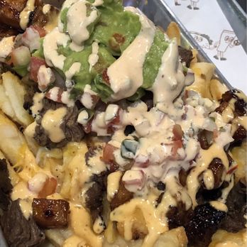 Tipsy Putt - Carne asada fries with added pork belly, absolutely fireeee - Pubs Near Me - Monterey, California Tipsy Putt - Carne asada fries with added pork belly, absolutely fireeee - Pubs Near Me - Monterey, California