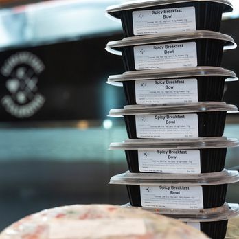 Clean Eatz - a stack of six takeout containers with a pizza in the background - Juice Bars & Smoothies Near Me - Troy, Michigan Clean Eatz - a stack of six takeout containers with a pizza in the background - Juice Bars & Smoothies Near Me - Troy, Michigan