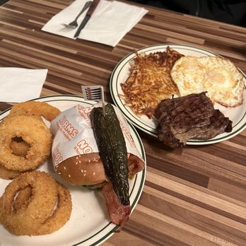 NORMS Restaurant - habanero jalapeno bacon cheeseburger with onion rings and steak eggs and hashbrown plate (side of hot cakes not pictured) - American Near Me - Huntington Beach, California