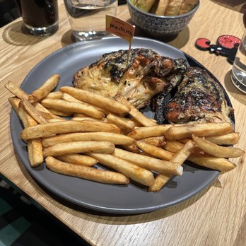 Nando's Peri-Peri - Half 1/2 Chicken and Chips, garlic bread in the back! - Portuguese Near Me - Chicago, Illinois