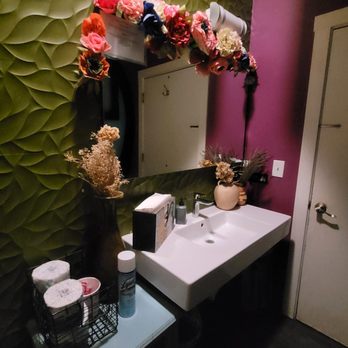 Mi Tocaya Antojeria - a bathroom with a sink and mirror - Mexican Near Me - Chicago, Illinois Mi Tocaya Antojeria - a bathroom with a sink and mirror - Mexican Near Me - Chicago, Illinois