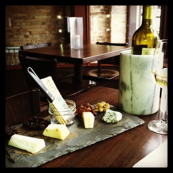 Madison's - Cheese plate with bottle of Conundrum - New American Near Me - Madison, Wisconsin