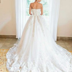 The D Storm Experience Eyelash & Beauty Lounge - Bridal chignon with elegant loops in the front.