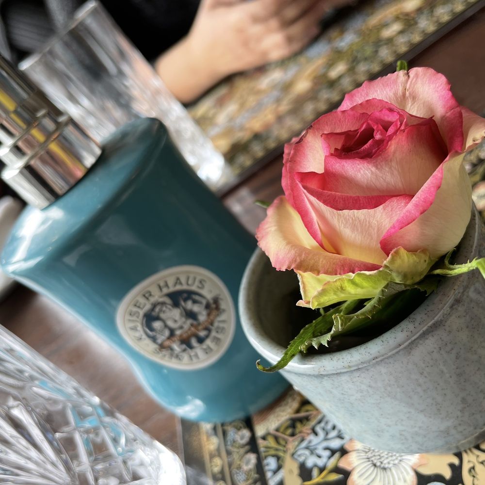 Kaiserhaus - a rose in a vase on a table - Comfort Food Near Me - St. Catharines, Ontario Kaiserhaus - a rose in a vase on a table - Comfort Food Near Me - St. Catharines, Ontario