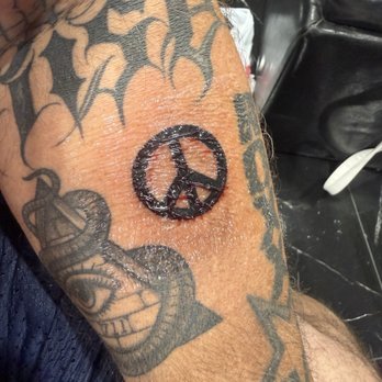 Secret Ink Tattoo Studio - Peace sign tattoo - Tattoo Near Me - Naples, Florida Secret Ink Tattoo Studio - Peace sign tattoo - Tattoo Near Me - Naples, Florida