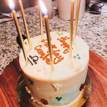Sunflour Baking Company - a birthday cake with candles - Cafes Near Me - Charlotte, North Carolina Sunflour Baking Company - a birthday cake with candles - Cafes Near Me - Charlotte, North Carolina