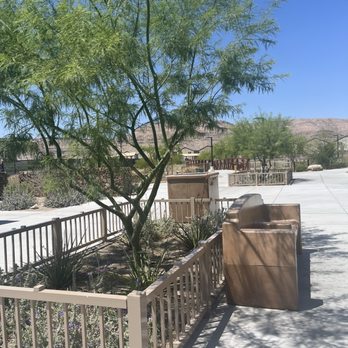 Lt Erik Lloyd Memorial Park - Gated plants, bench, large trash can in the back - Parks Near Me - Las Vegas, Nevada