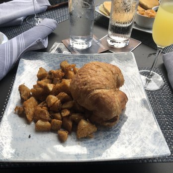 Edgar's Proof & Provision Savannah - Breakfast Croissant with Breakfast Potatoes - Cocktail Bars Near Me - Savannah, Georgia