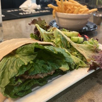 The 18hundred - Lettuce wrapped burger (all double patties.) Each come with a side salad. Add on fries to share. - New American Near Me - Bakersfield, California The 18hundred - Lettuce wrapped burger (all double patties.) Each come with a side salad. Add on fries to share. - New American Near Me - Bakersfield, California