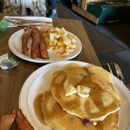 Short stack blueberry pancakes and locally sourced bacon with house made American hash browns. Short stack blueberry pancakes and locally sourced bacon with house made American hash browns.