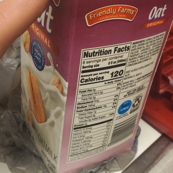 ALDI - a hand reaching for a carton of milk - Grocery Near Me - Marietta, Georgia