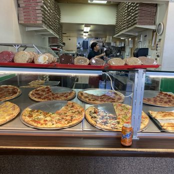 Yaghi's New York Pizzeria - Front counter pizza by the slice with it you can get a soda - Pizza Near Me - Austin, Texas