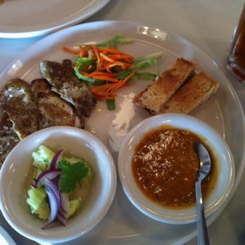 Siam Cuisine - Pork satay...comes with peanut sauce and cucumber salad. - Thai Near Me - Schertz, Texas Siam Cuisine - Pork satay...comes with peanut sauce and cucumber salad. - Thai Near Me - Schertz, Texas