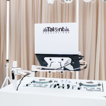 Talent Productions Inc. - Modern all white DJ podium setup designed for elegant weddings with professional lighting and a clean luxury aesthetic. - DJs Near Me - Edmonton, Alberta Talent Productions Inc. - Modern all white DJ podium setup designed for elegant weddings with professional lighting and a clean luxury aesthetic. - DJs Near Me - Edmonton, Alberta