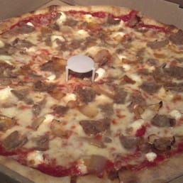 The Rustica- Italian sausage, caramelized onions, ricotta cheese, and mozzarella cheese. Most delicious house specialty! The Rustica- Italian sausage, caramelized onions, ricotta cheese, and mozzarella cheese. Most delicious house specialty!