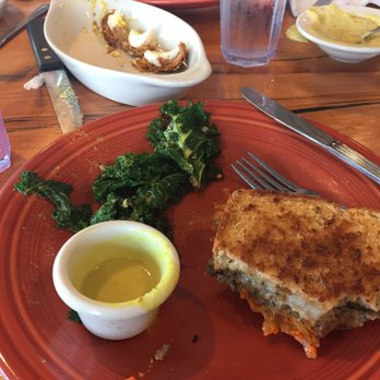 Duluth Grill - Wild rice patty with grilled marinated kale with green curry sauce. Scotch eggs in background. - Breakfast & Brunch Near Me - Duluth, Minnesota Duluth Grill - Wild rice patty with grilled marinated kale with green curry sauce. Scotch eggs in background. - Breakfast & Brunch Near Me - Duluth, Minnesota
