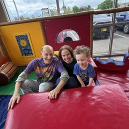 Grandpa, Mom, birthday boy in special toddler area