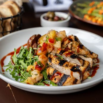 Boca Bistro - Chicken - Grilled marinated chicken breast, roasted potatoes, arugula, pineapple salsa, honey chipotle glaze - Spanish Near Me - Saratoga Springs, New York