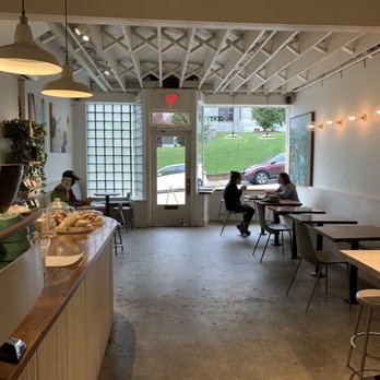 Orchard Coffee - a woman sitting at a table in a coffee shop - Coffee & Tea Near Me - Waynesville, North Carolina Orchard Coffee - a woman sitting at a table in a coffee shop - Coffee & Tea Near Me - Waynesville, North Carolina