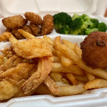 Sam's St Johns Seafood Restaurant - Coconut shrimp, fried shrimp ,clam strips ,broccoli ,French fries , and hush puppies - Seafood Near Me - Jacksonville, Florida Sam's St Johns Seafood Restaurant - Coconut shrimp, fried shrimp ,clam strips ,broccoli ,French fries , and hush puppies - Seafood Near Me - Jacksonville, Florida