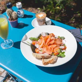 Coffeelicious - A delicious salad with a fresh juice and a flat white in the sunny garden. - Coffee & Tea Near Me - Rotterdam, ZH