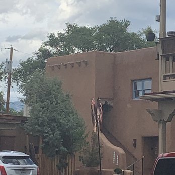 Vanessie - a red truck parked in front of a building - Bars Near Me - Santa Fe, New Mexico