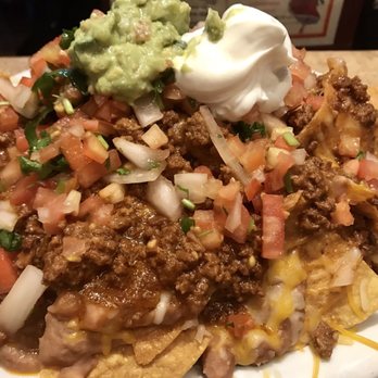 Amigo's - A huge mound of chicken nachos - Mexican Near Me - Kahului, Hawaii Amigo's - A huge mound of chicken nachos - Mexican Near Me - Kahului, Hawaii