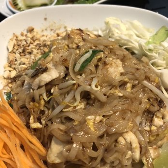 Thai Bistro - Chicken pad Thai with Chicken satay in the background - Thai Near Me - Bartlett, Tennessee Thai Bistro - Chicken pad Thai with Chicken satay in the background - Thai Near Me - Bartlett, Tennessee