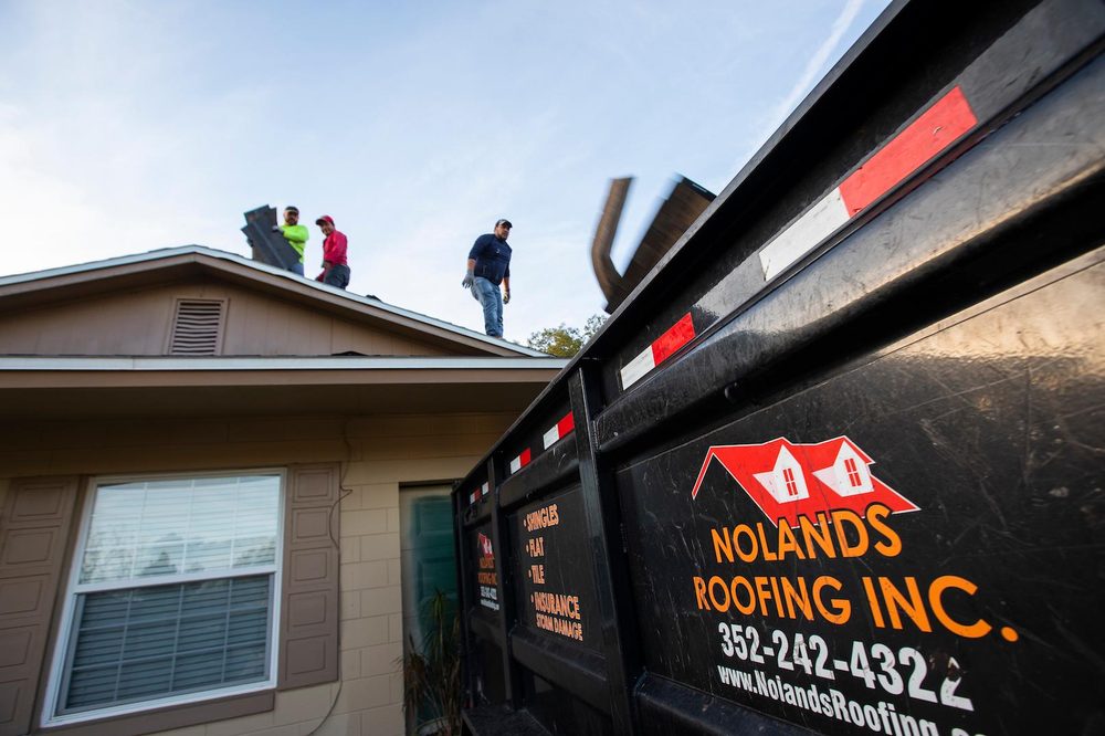Slide of Noland's Roofing