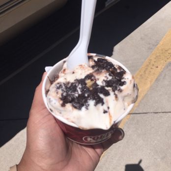 Cold Stone Creamery - a hand holding a cup of ice cream - Ice Cream & Frozen Yogurt Near Me - Branson, Missouri