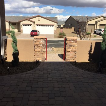 R.E. and Sons Landscaping - Spiral junipers in the courtyard - Landscaping Near Me R.E. and Sons Landscaping - Spiral junipers in the courtyard - Landscaping Near Me
