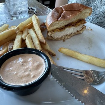 Foster's Kitchen Waikoloa - Buffalo chicken sandwich (sauce on the side- it's SPICY) and regular fries.... Forgot to take photo until half way done - American Near Me - Waikoloa, Hawaii