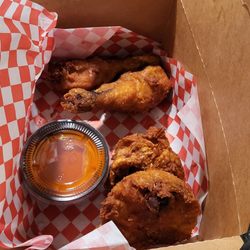Golden Roosters - 4 piece Dark, two thighs, two drumsticks with some Buffalo sauce