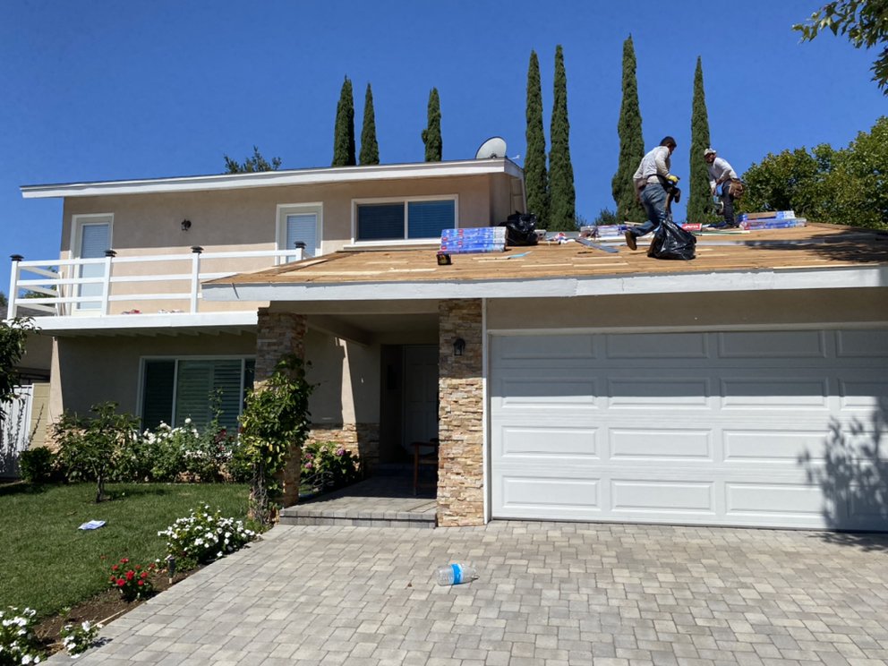 Slide of Michiel Roofing