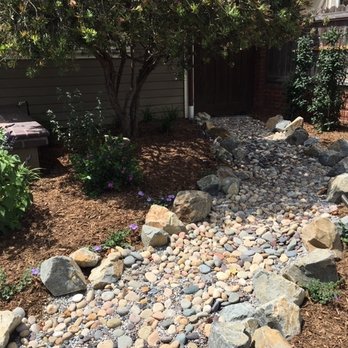 Gardens For All Seasons - Dry stream bed bordered by drought tolerant flowers. Love it. - Landscaping Near Me Gardens For All Seasons - Dry stream bed bordered by drought tolerant flowers. Love it. - Landscaping Near Me