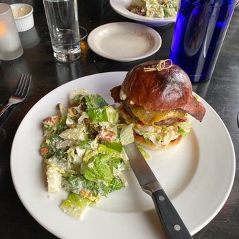 The Blue Glass - Blue Glass burger with bacon and side Cesar salad. - Cocktail Bars Near Me - Seattle, Washington