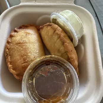 Miss Arepa - Plant based mushroom and cheese empenadas with plant based cilantro/ oil/ spices sauce and non plant based white sauce. - Venezuelan Near Me - Lahaina, Hawaii Miss Arepa - Plant based mushroom and cheese empenadas with plant based cilantro/ oil/ spices sauce and non plant based white sauce. - Venezuelan Near Me - Lahaina, Hawaii