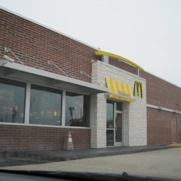 the front of a mcdonald's restaurant the front of a mcdonald's restaurant