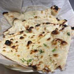 Anand Restaurant - Order of garlic naan, a bit on the thinner side with bit of a crunch and slight chew. Still tasty!
