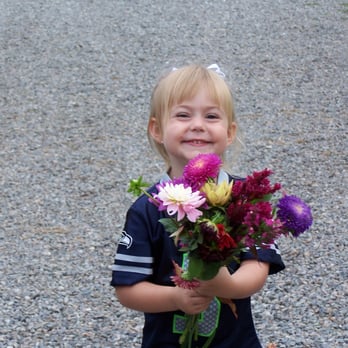 Root Connection CSA - a little girl holding a bunch of flowers - CSA Near Me - Redmond, Washington Root Connection CSA - a little girl holding a bunch of flowers - CSA Near Me - Redmond, Washington