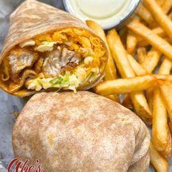 Abe's Place Tap & Grill - Wrapped up and ready to go--crispy chicken, your favorite wing sauce, and all the fixings. A classic done right at Abe's Place.