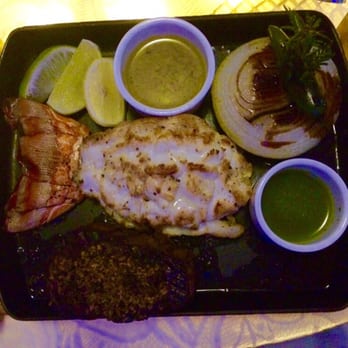Casitas - Lobster Tail as an addition to a 10oz Filet Mignon with a grilled onion and a Serrano pepper. I ordered my filet medium rare. - Seafood Near Me - Cancún, ROO Casitas - Lobster Tail as an addition to a 10oz Filet Mignon with a grilled onion and a Serrano pepper. I ordered my filet medium rare. - Seafood Near Me - Cancún, ROO