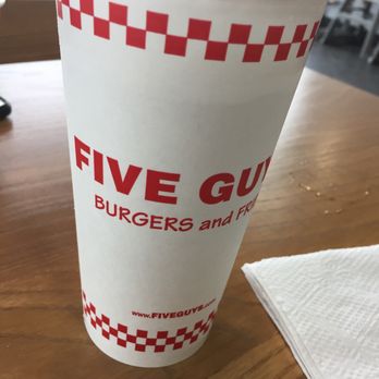 Five Guys - a paper cup on a table - Burgers Near Me - Ranson, West Virginia