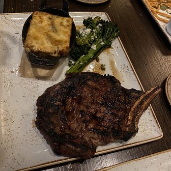 J Gilbert's - Cowboy steak with potatoes and broccolini - Bars Near Me - Omaha, Nebraska