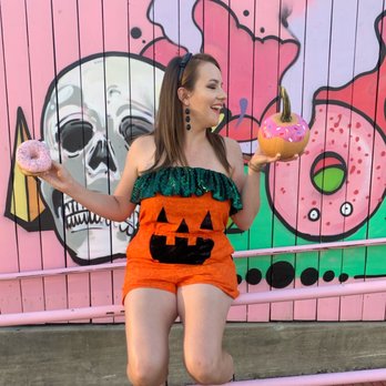 Voodoo Doughnut - Fun mural on the outside fence - Donuts Near Me - Houston, Texas