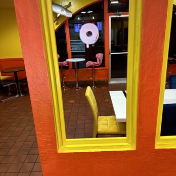 Crispy Donuts-Wichita - a yellow chair in a restaurant - Donuts Near Me - Wichita, Kansas Crispy Donuts-Wichita - a yellow chair in a restaurant - Donuts Near Me - Wichita, Kansas
